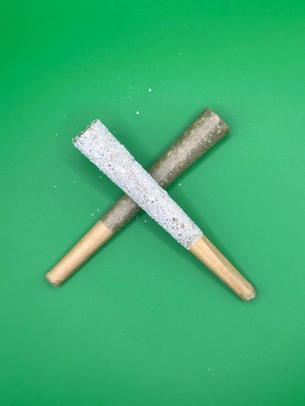 Iced THCA pre-roll and regular THCA pre-roll crossed in an X