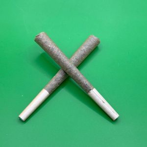 Two THCA hemp pre-rolls crossed in an X with white filter tips