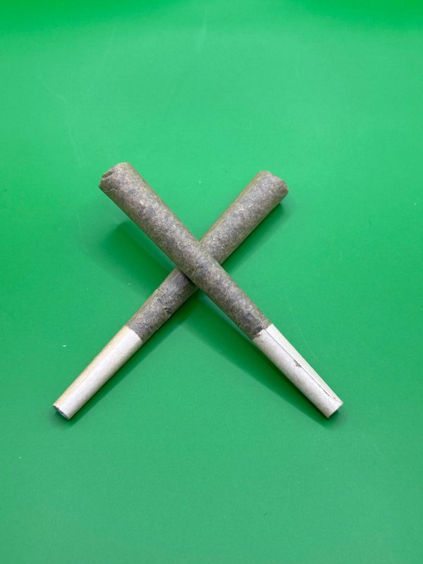 Two THCA hemp pre-rolls crossed in an X with white filter tips